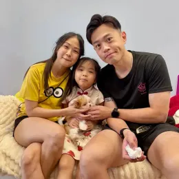A Curious Tails customer with their new puppy in Singapore